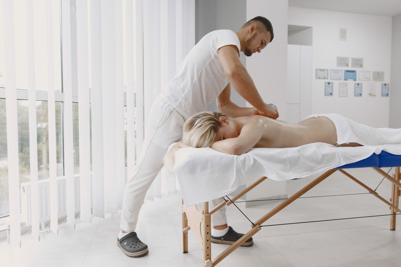 Therapist giving a full body massage on a massage table in Dubai